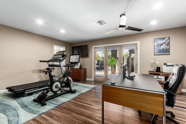 exercise area featuring hardwood / wood-style flooring and ceiling fan