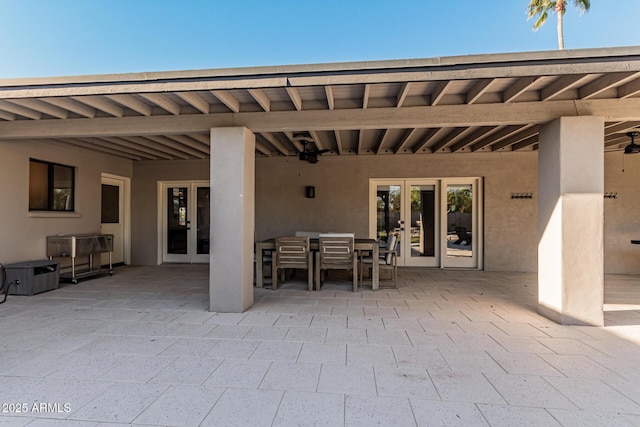 view of patio with ceiling fan and french doors