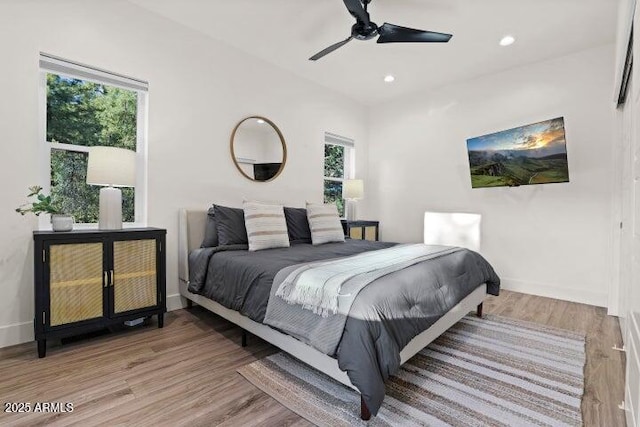 bedroom featuring ceiling fan and light hardwood / wood-style flooring