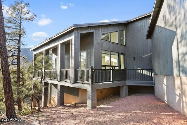 view of property exterior featuring a sunroom