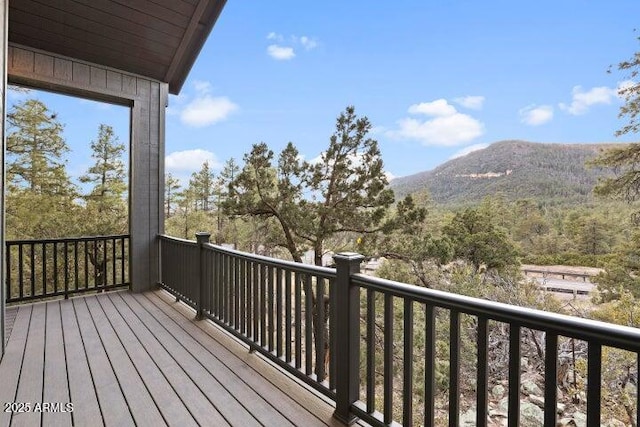 wooden terrace with a mountain view