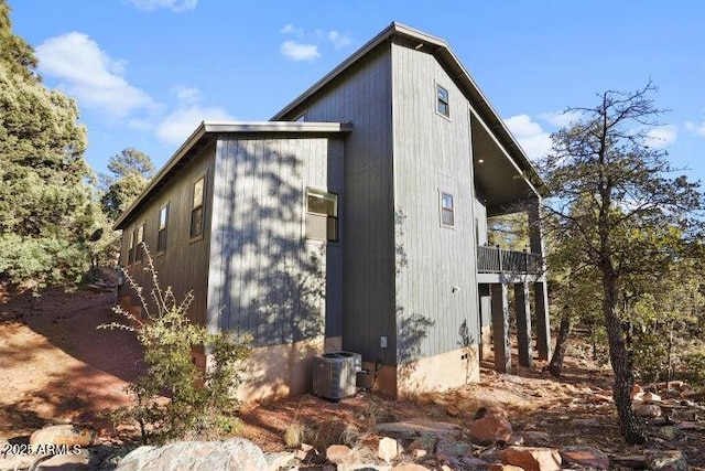 view of property exterior featuring central AC