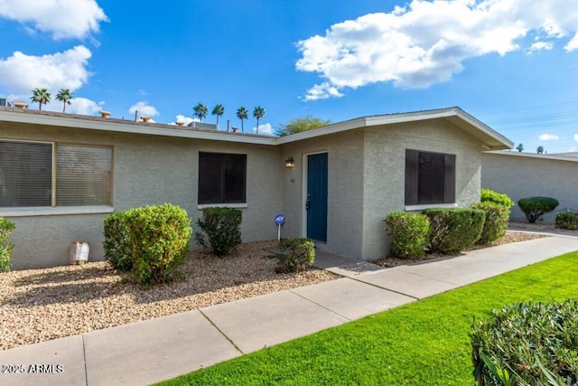 single story home with stucco siding