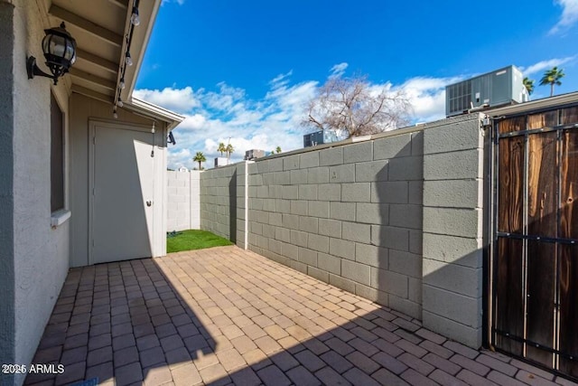 view of patio featuring central AC unit and a fenced backyard