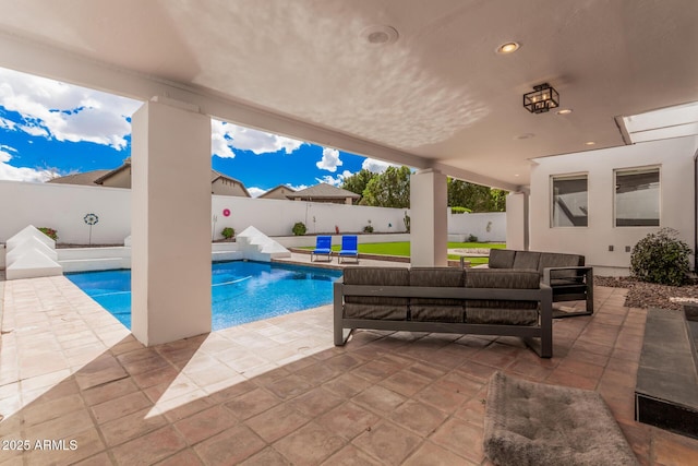 view of swimming pool with a patio area, a fenced backyard, and a fenced in pool