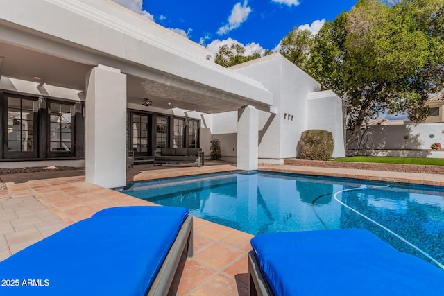 view of pool with a fenced in pool, a patio, and an outdoor hangout area