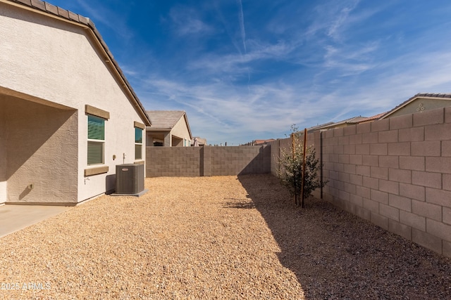 view of yard featuring a fenced backyard and cooling unit