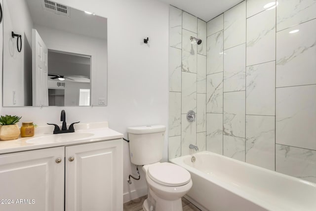 full bathroom with vanity, ceiling fan, tiled shower / bath, and toilet