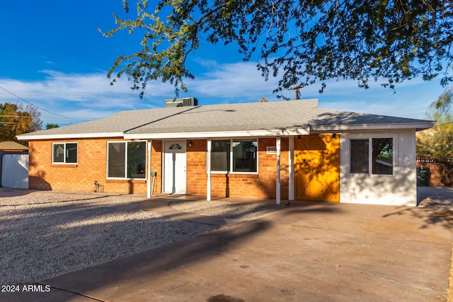 ranch-style home with central AC