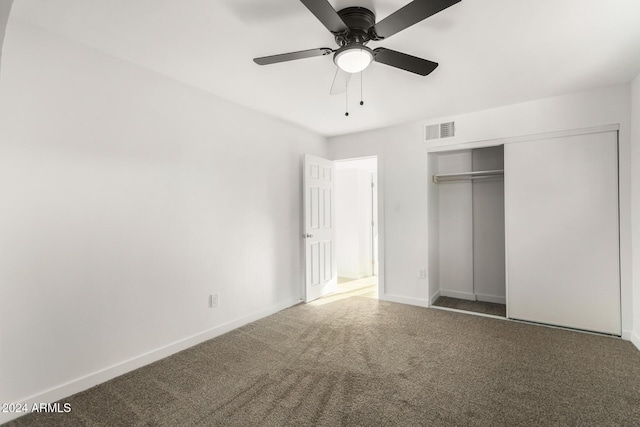 unfurnished bedroom with ceiling fan, a closet, and carpet