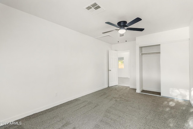 unfurnished bedroom with carpet, ceiling fan, and a closet