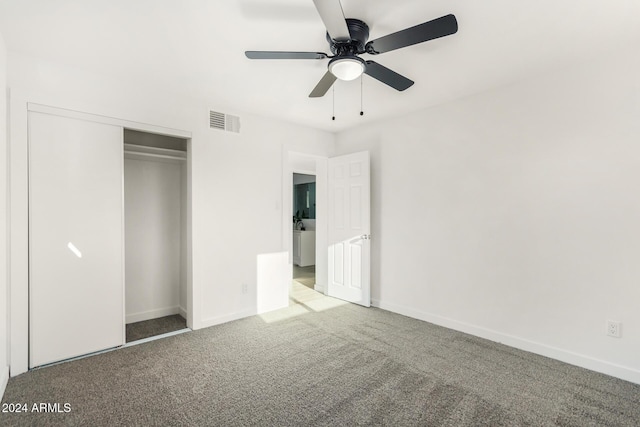 unfurnished bedroom with light carpet, a closet, and ceiling fan