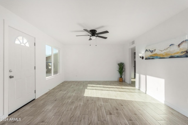 interior space with ceiling fan and light hardwood / wood-style flooring