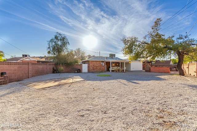 back of house with a patio