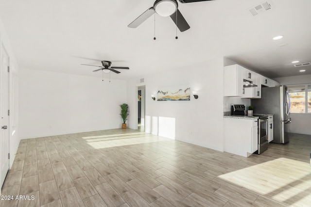 unfurnished living room with ceiling fan and light hardwood / wood-style flooring