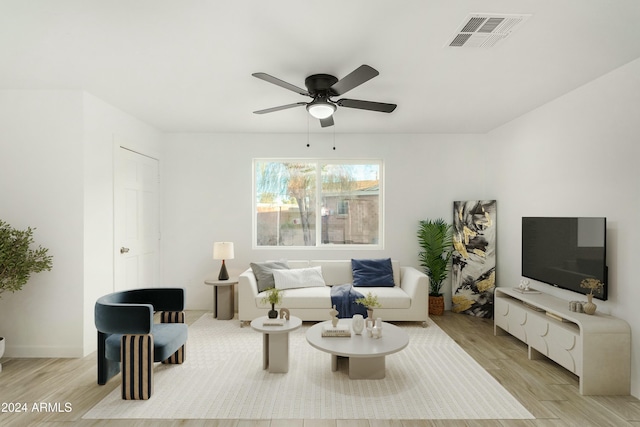 living room featuring light wood-type flooring and ceiling fan