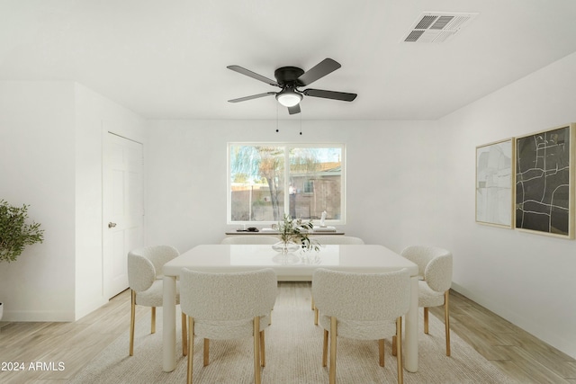 dining room featuring ceiling fan and light hardwood / wood-style flooring