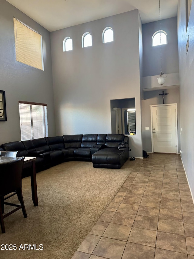 9108 W Kirby Ave, Tolleson, AZ 85353 - tiled living area with baseboards and a high ceiling