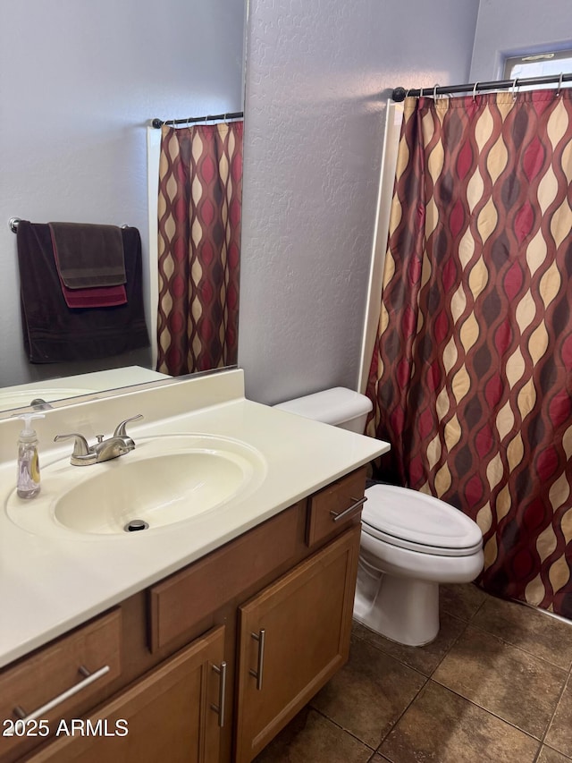 9108 W Kirby Ave, Tolleson, AZ 85353 - bathroom with a textured wall, curtained shower, vanity, and toilet