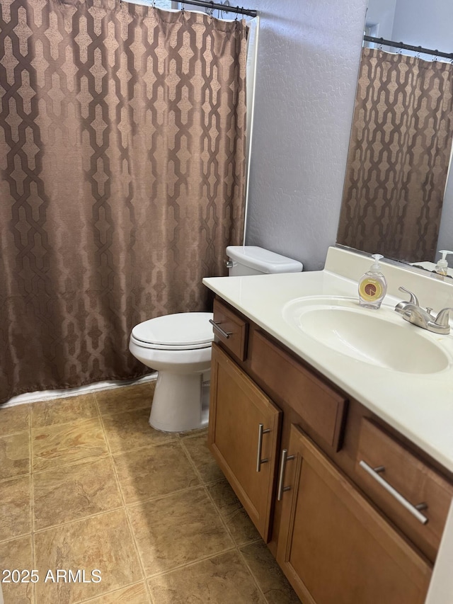 9108 W Kirby Ave, Tolleson, AZ 85353 - full bath with a shower with shower curtain, vanity, and toilet
