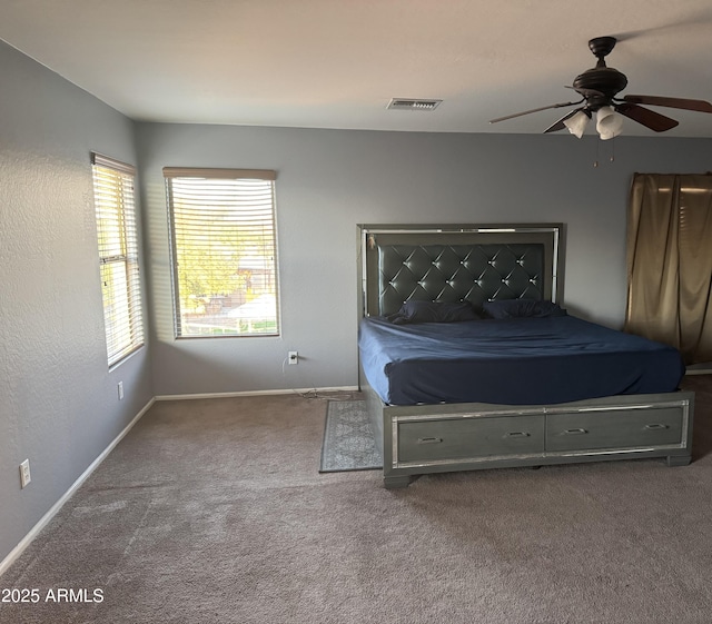 9108 W Kirby Ave, Tolleson, AZ 85353 - carpeted bedroom with baseboards, a ceiling fan, and visible vents
