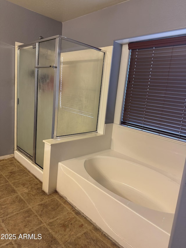 9108 W Kirby Ave, Tolleson, AZ 85353 - full bath with a shower stall, tile patterned flooring, and a garden tub