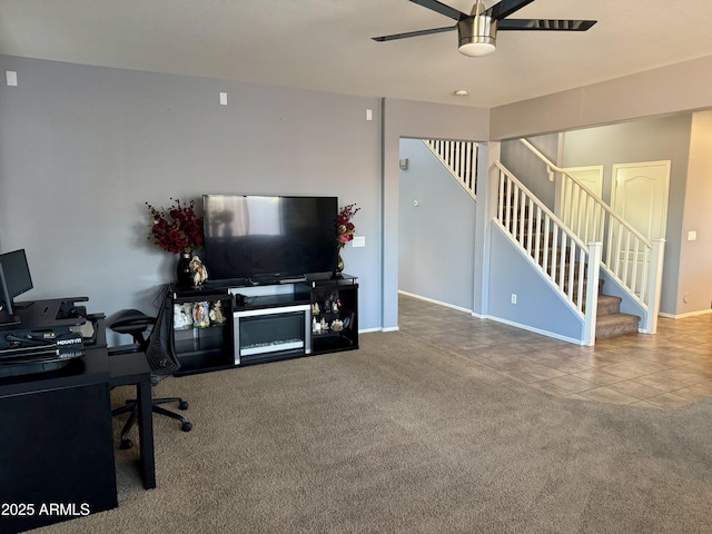 9108 W Kirby Ave, Tolleson, AZ 85353 - carpeted living area featuring tile patterned flooring, stairway, baseboards, and ceiling fan