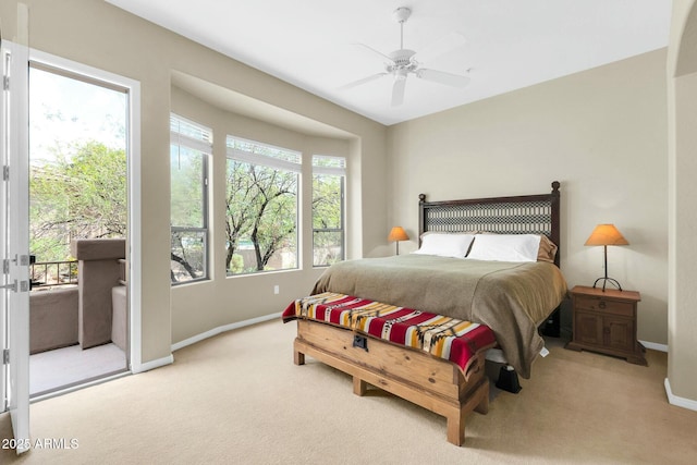 bedroom with access to outside, carpet, a ceiling fan, and baseboards