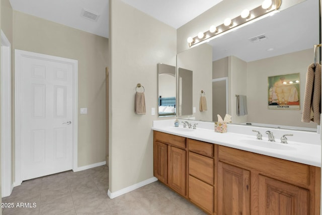 full bath with visible vents, a sink, and tile patterned floors