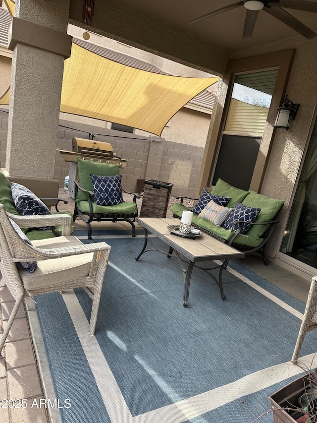 view of patio / terrace featuring area for grilling and ceiling fan