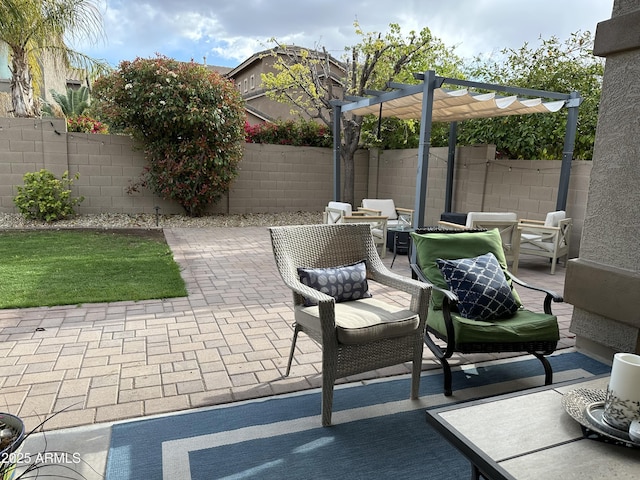 view of patio featuring a pergola and a fenced backyard