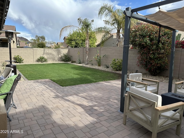 view of patio / terrace with a fenced backyard and a pergola