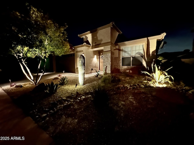 view of property exterior at twilight