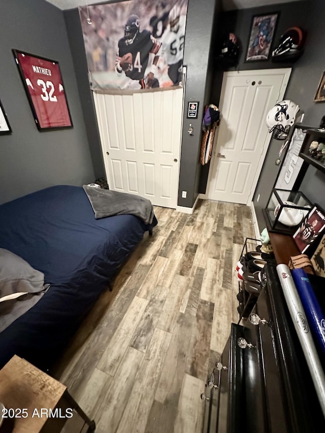 bedroom featuring wood finished floors