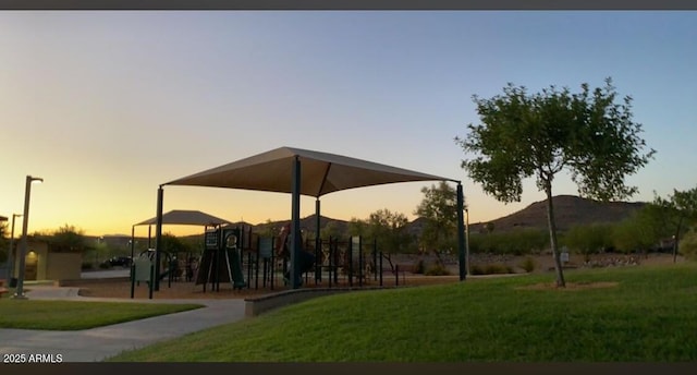 surrounding community with a lawn and playground community