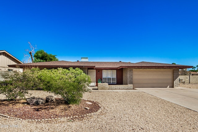 ranch-style home with a garage