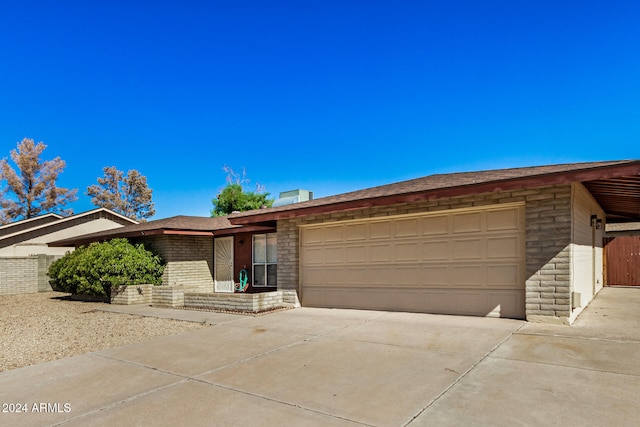 single story home featuring a garage