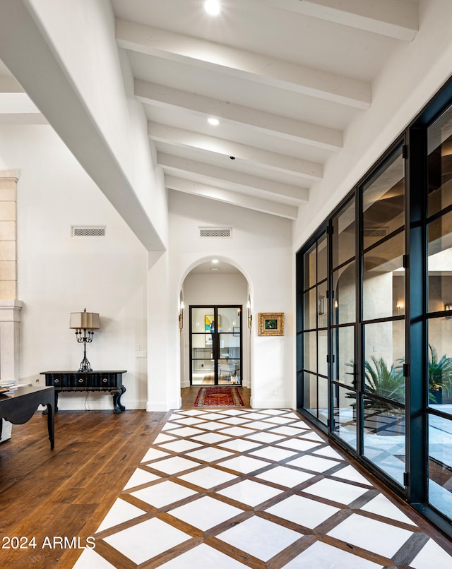 hall with vaulted ceiling with beams and hardwood / wood-style flooring