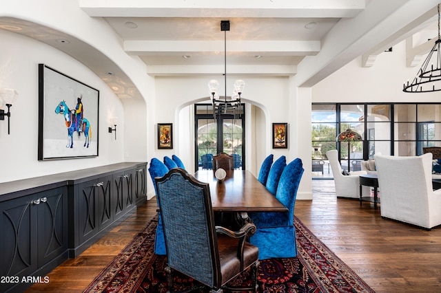 dining space with a wealth of natural light, beamed ceiling, and dark wood-type flooring