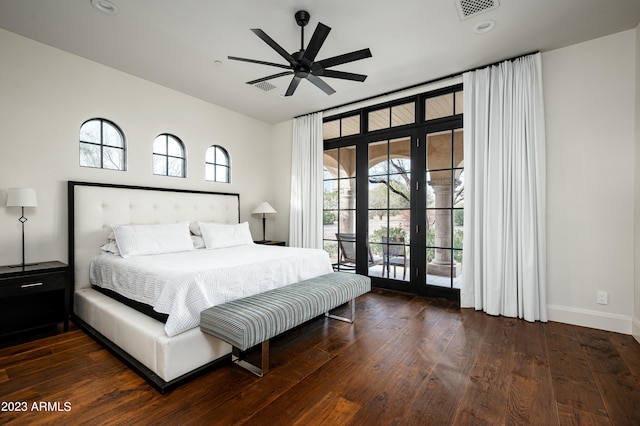 bedroom featuring access to outside, dark hardwood / wood-style flooring, ceiling fan, and french doors