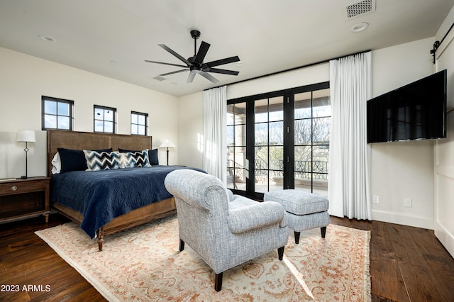 bedroom featuring ceiling fan and dark hardwood / wood-style floors