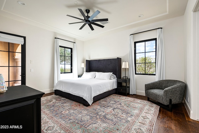 bedroom featuring ceiling fan and dark hardwood / wood-style flooring