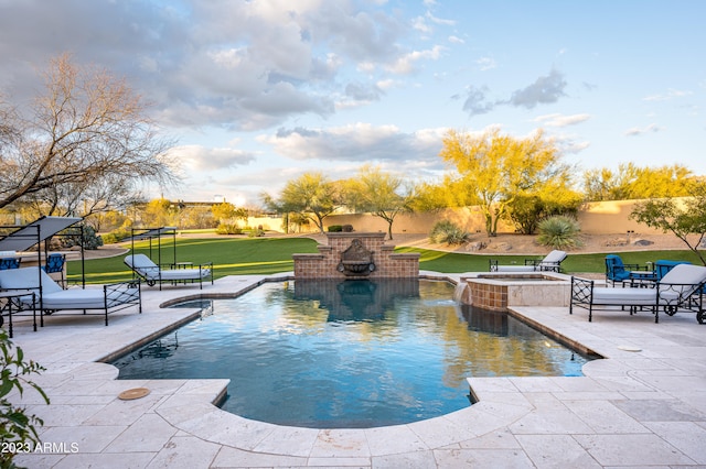 view of pool featuring a lawn and a patio area