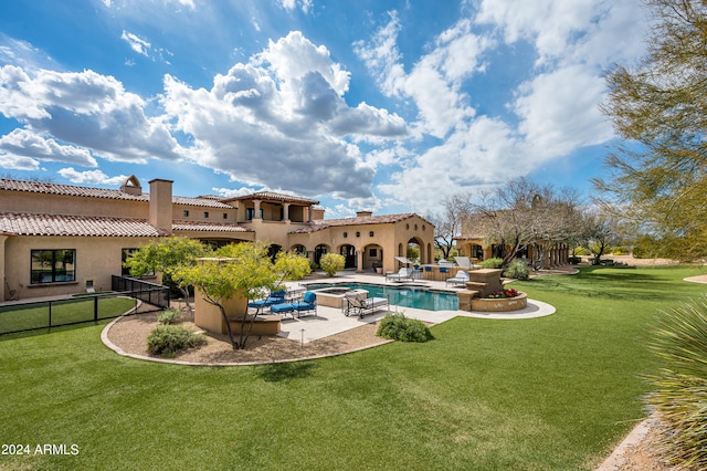 view of swimming pool with a patio and a lawn