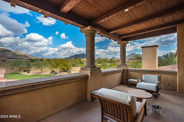 view of patio / terrace featuring a balcony and a mountain view