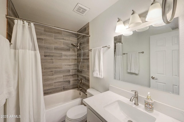 bathroom with toilet, shower / bath combo, vanity, and visible vents