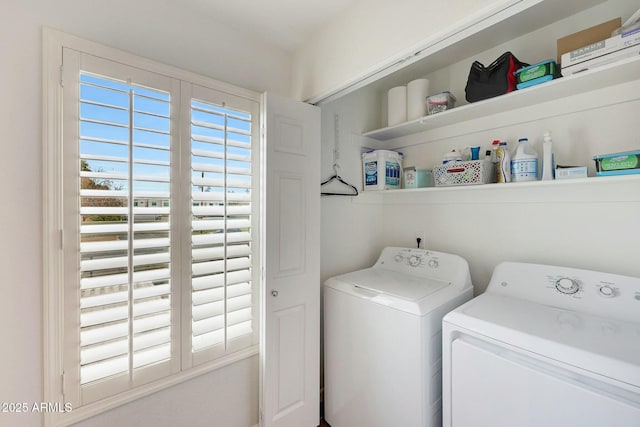 washroom featuring laundry area and separate washer and dryer