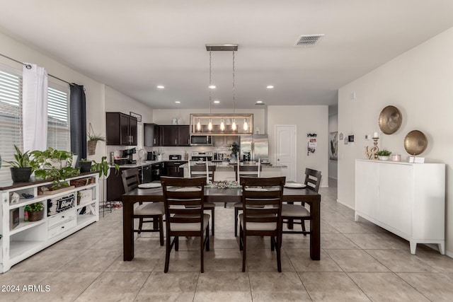 dining space with light tile patterned flooring