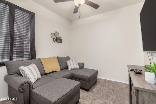 living room featuring light carpet and ceiling fan