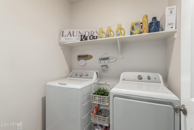 laundry area with separate washer and dryer